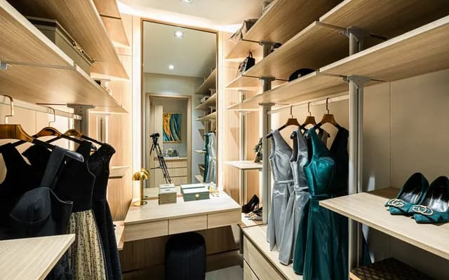 Walk-in wardrobe with shelves, hanging clothes and drawers