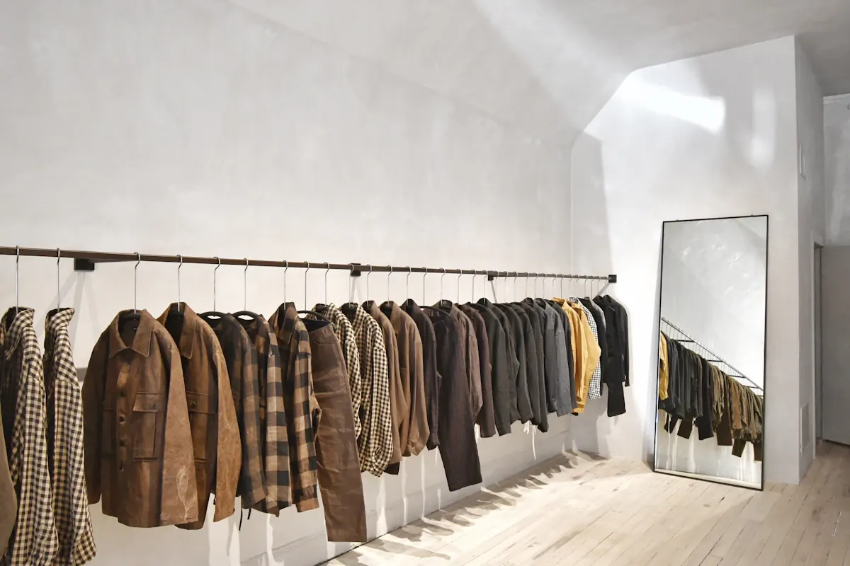 Dressing area with a long clothing rail and mirror