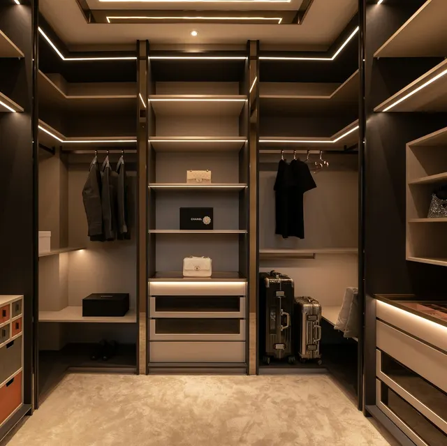 Dark walk-in wardrobe with illuminated shelves and drawers